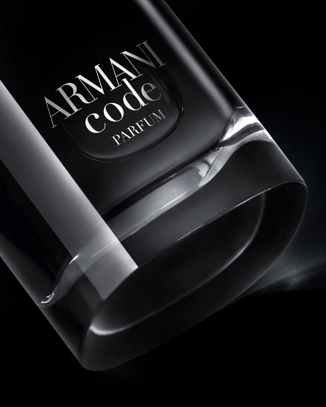 Armani Code Parfum bottle on a black background