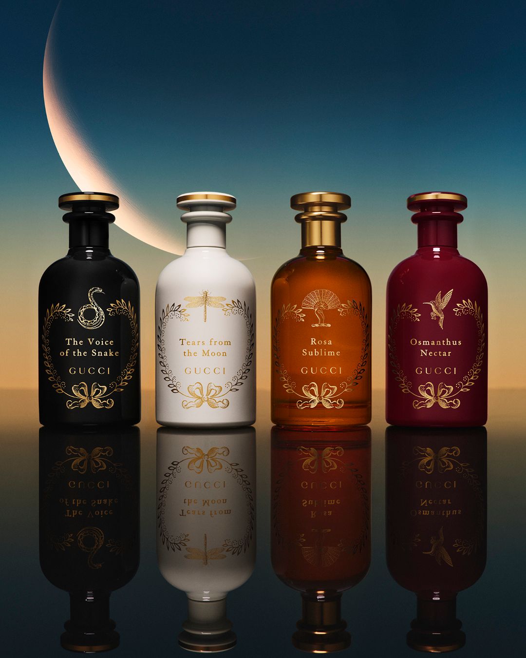 Four Gucci perfume bottles with decorative labels against a gradient background.