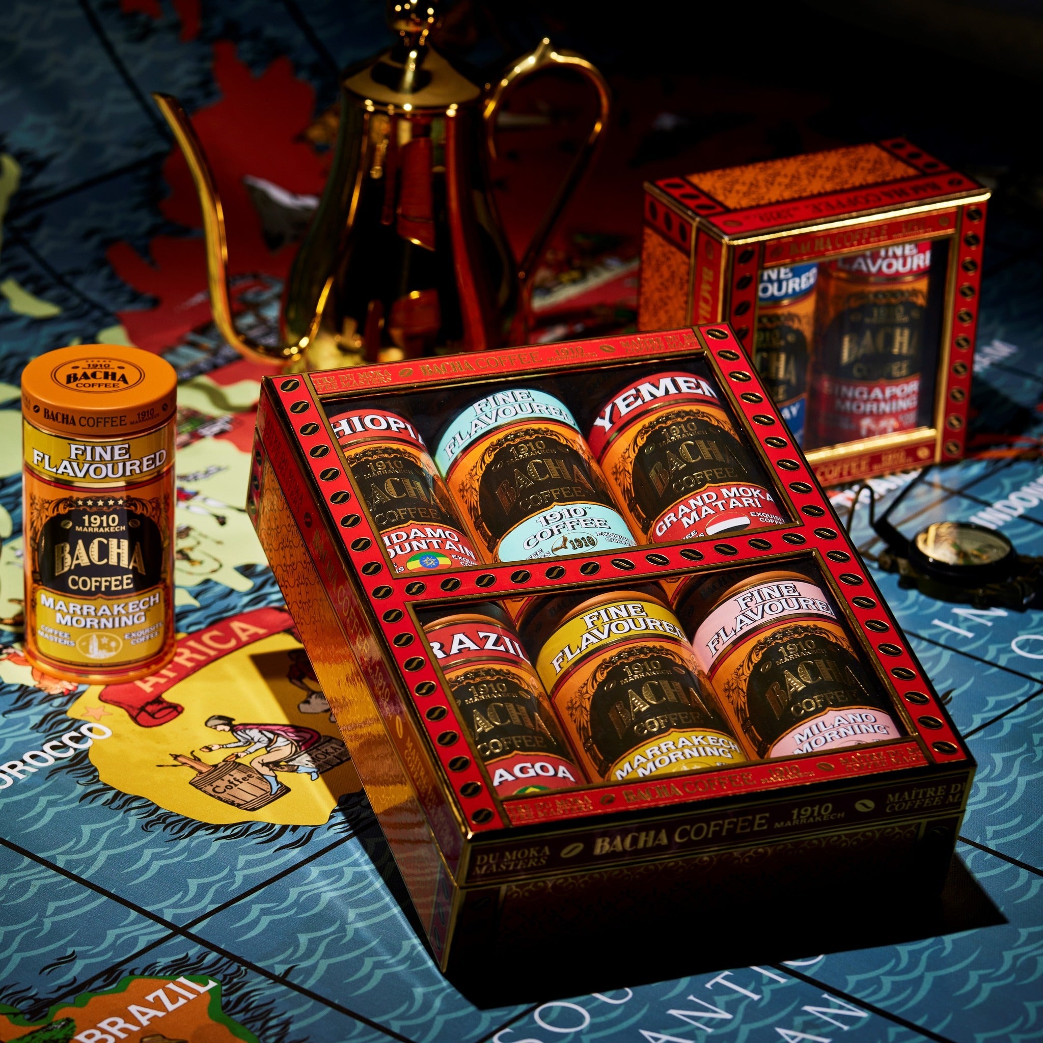 Bacha coffee packaging with various flavors on a decorative tablecloth.
