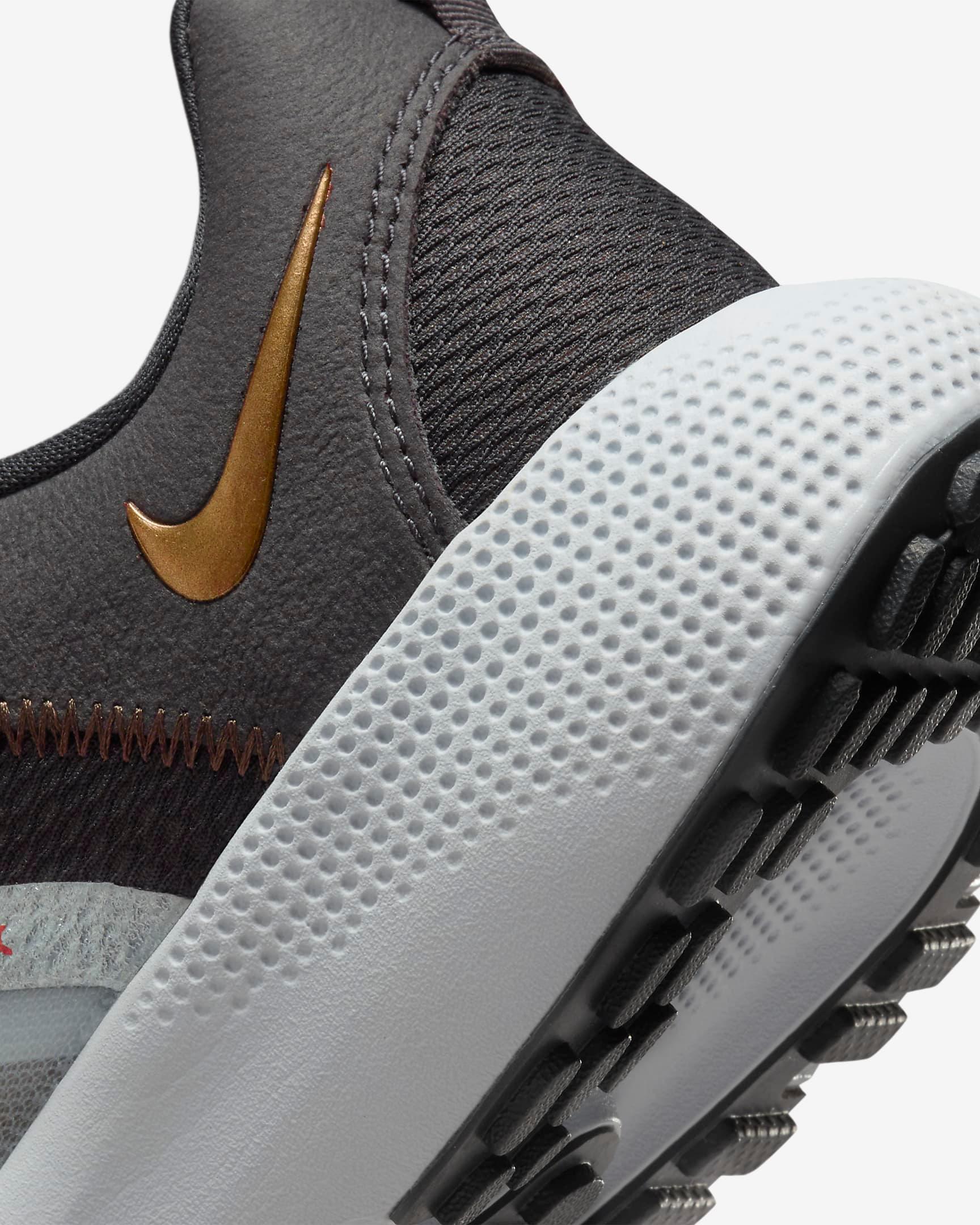 grey nike shoes with gold swoosh